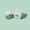 Ein rundes Glas mit Rescue Mini Masks und Toner Pads neben der quadratischen Verpackungsschachtel.