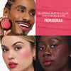 Drei Personen unterschiedlicher Hautfarbe tragen den tiefpinken Farbton "Primadonna" aus dem Yummy Skin Flushed Essentials Blush & Lip Kit von Danessa Myricks Beauty.