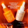 Zwei Flaschen Lumene Nordic-C Dark Spot Serum mit Tropfer auf orangefarbenem Hintergrund, die als klinisch getestete aufhellende Seren gekennzeichnet sind.