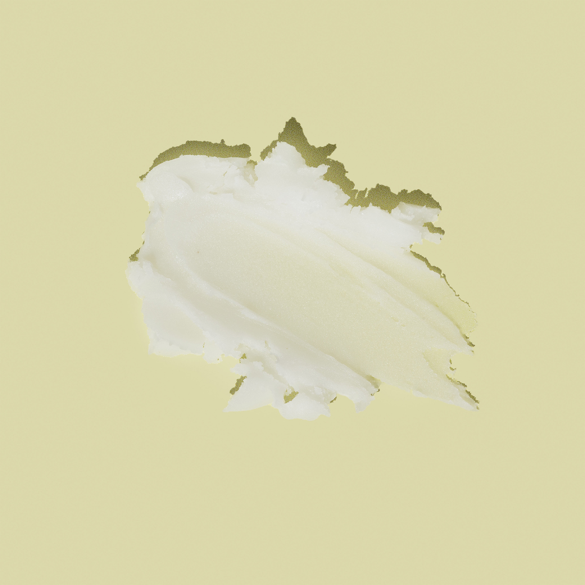 Ein Klecks der dickflüssigen, weißen Hautpflegecreme Glycolic Acid Body Stick.
