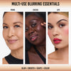 Drei Frauen verwenden das Yummy Skin Flushed Essentials Blush & Lip Kit von Danessa Myricks Beauty für Grundierung, Rouge und als Lippenfarbe; der Text lautet "Multi-Use Blurring Essentials".