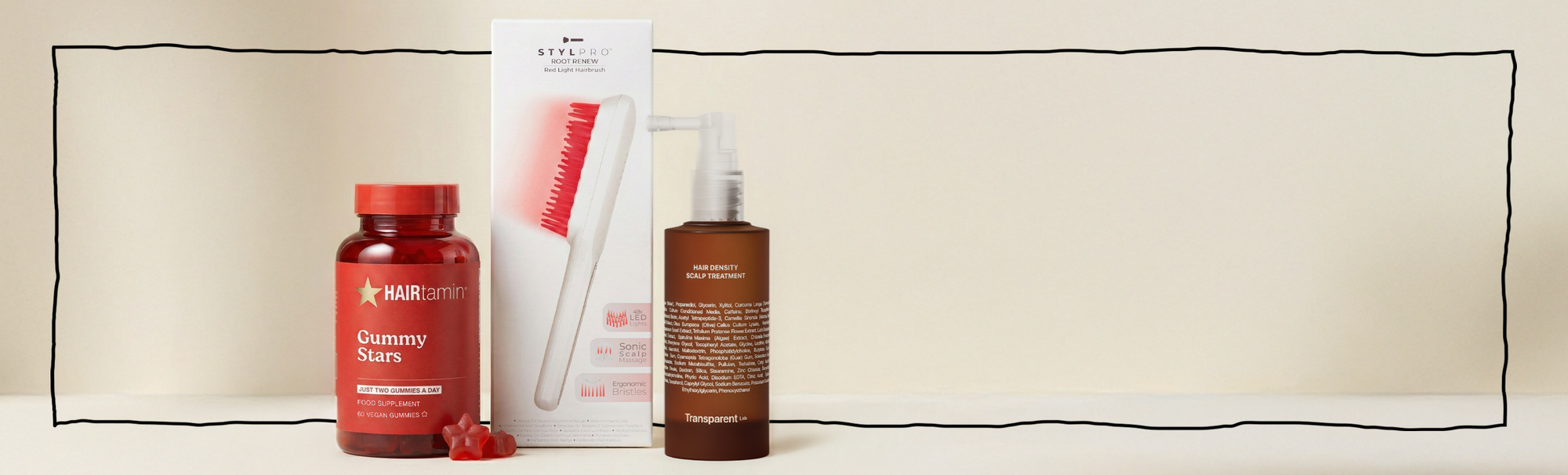 Hairtamin Gummy Stars, STYLPRO LED-Scalp-Brush und Transparent Lab Hair Density Treatment als Haarpflege-Set auf hellem Hintergrund.