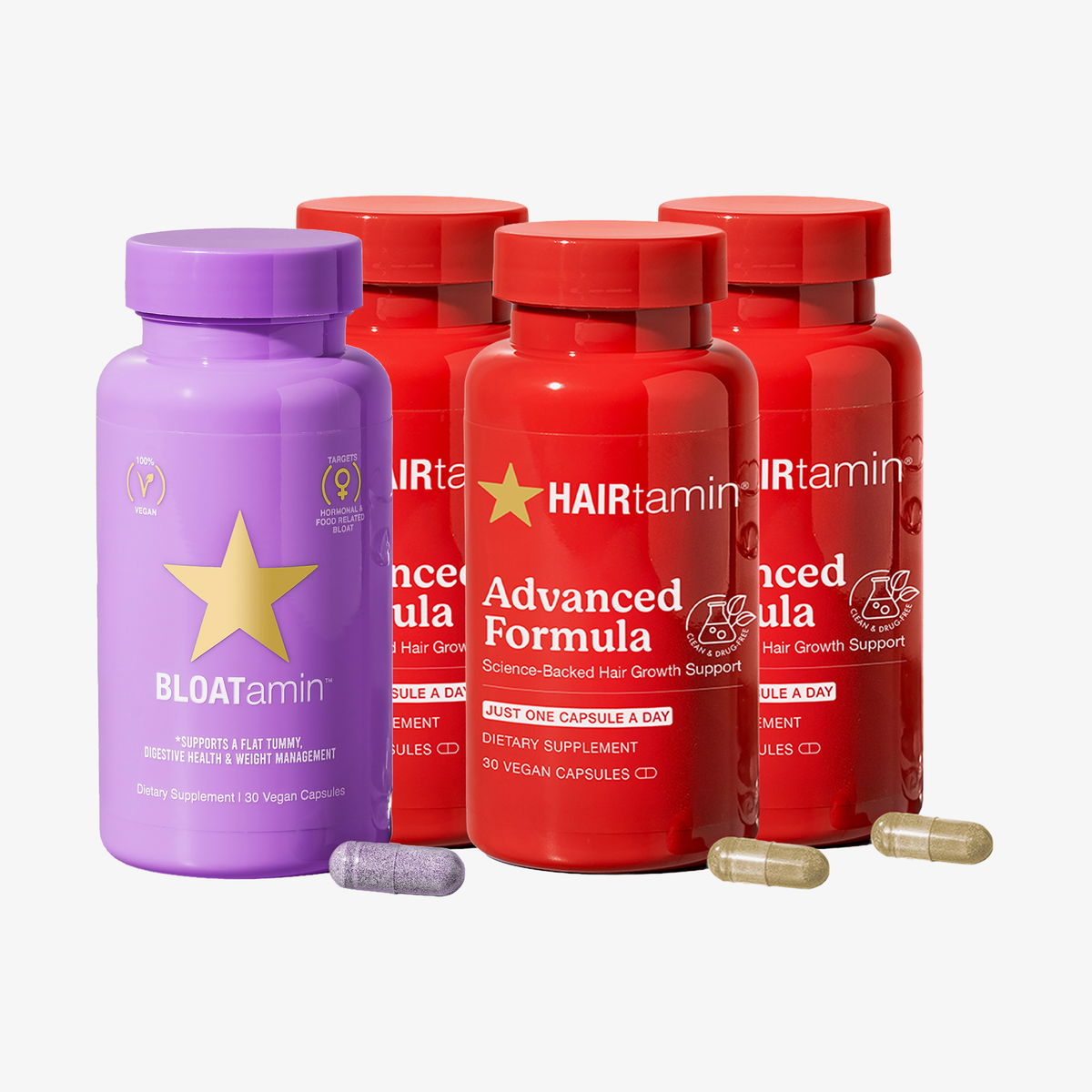 HAIRtamin Advanced Debloat Bundle mit drei roten Advanced Formula Flaschen, einer lila BLOATamin Flasche und Kapseln im Vordergrund.