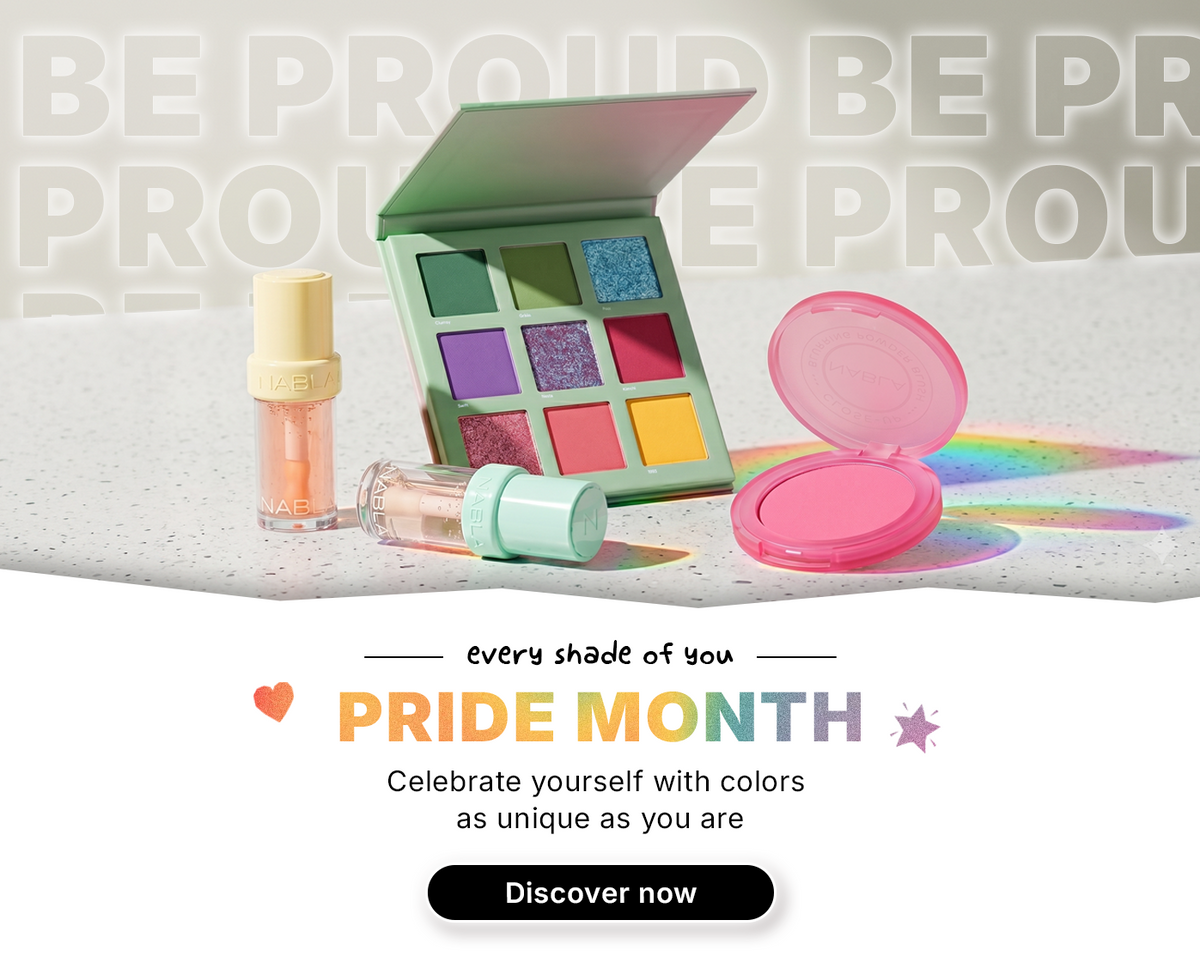 Eine farbenfrohe Make-up-Palette und ein Rouge mit dem Text Pride Month und einer Schaltfläche Discover now auf einer gesprenkelten Oberfläche.