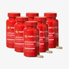 HAIRtamin Advanced Formula 6-Monats-Bundle mit sechs roten Flaschen Nahrungsergänzung und sichtbaren Kapseln für Haarwachstum.