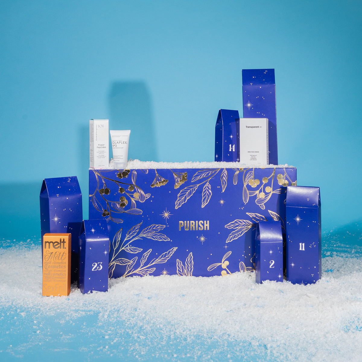 PURISH Beauty Adventskalender 2024 mit Türchen, Beispielprodukten und Schnee vor blauem Hintergrund