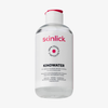 Eine durchsichtige Flasche Skinlick Kindwater Mizellenlösung, 250ml, mit weißem und rosa Etikett und schwarzem Flip-Top-Verschluss.