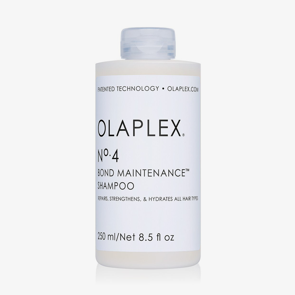 Eine Flasche OLAPLEX No.4 Bond Maintenance Shampoo 250 ml. Weißer Hintergrund.